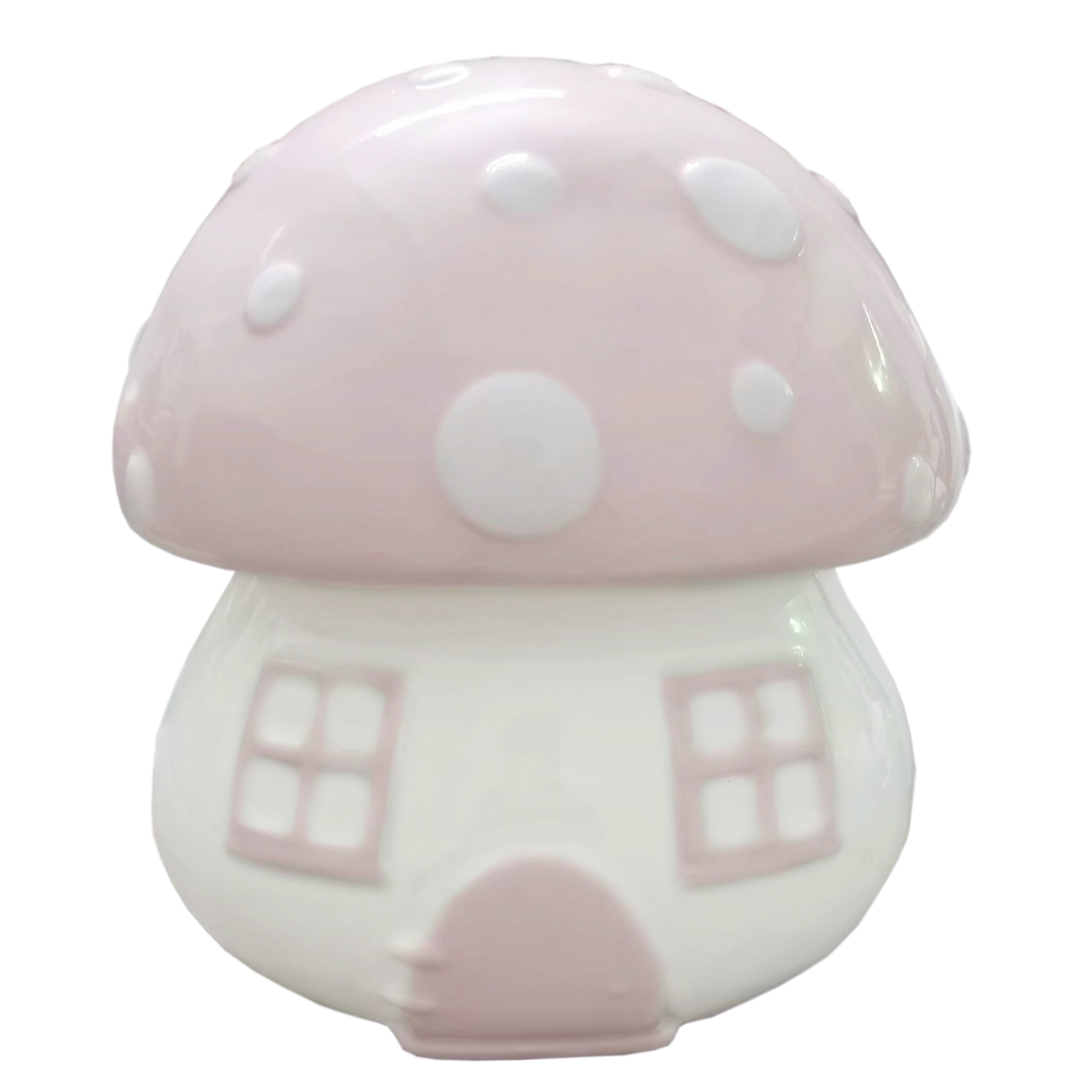 Front view of pink mushroom shaped ceramic piggy bank with white polka dots and window details