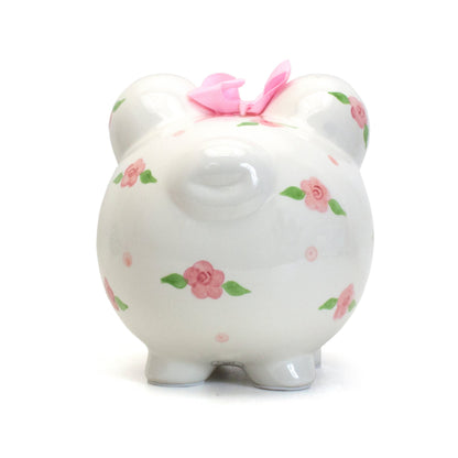 Piggy bank front and back views side by side showing detailed handpainted flowers and signature pink bow