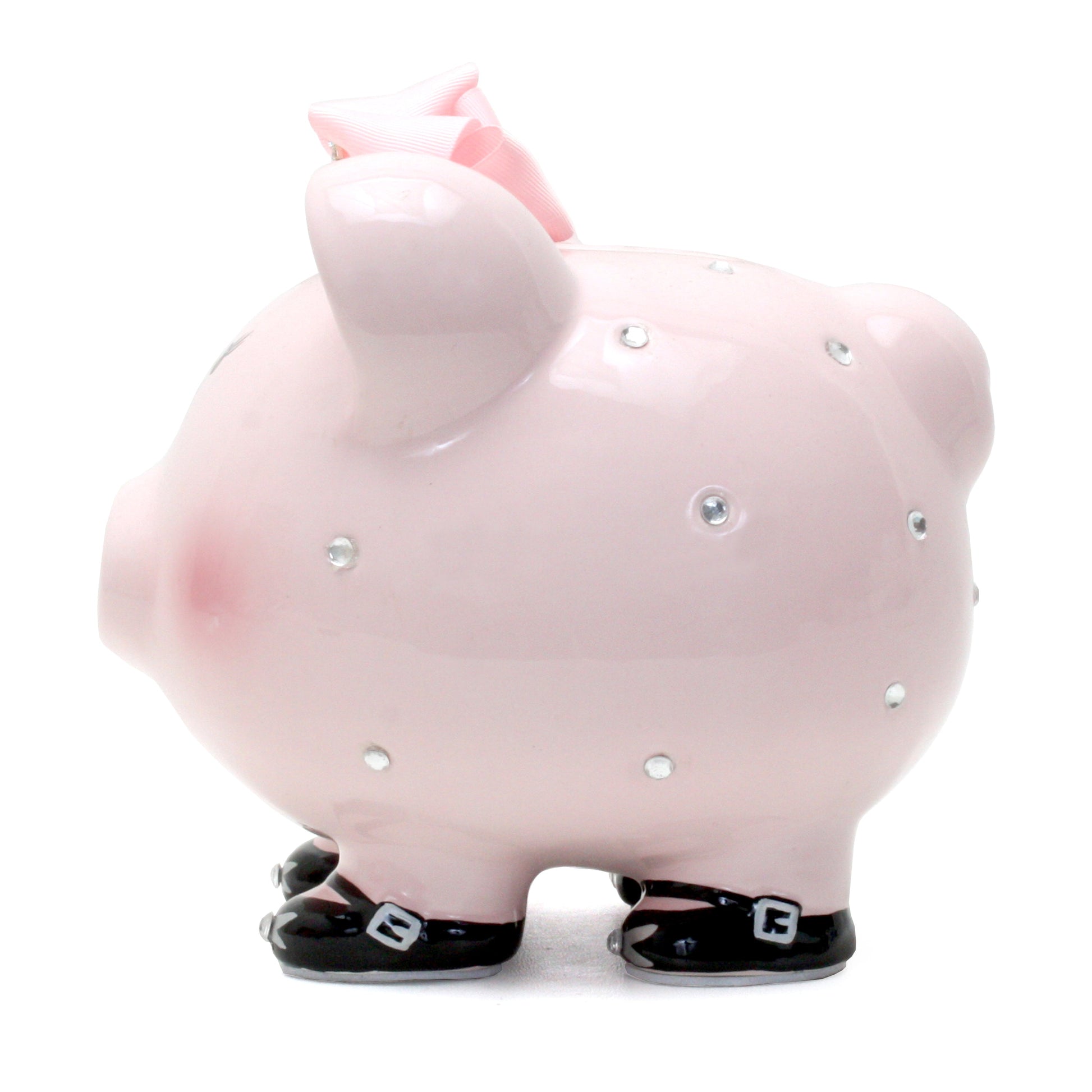 Child holding the pink princess piggy bank with a loving expression