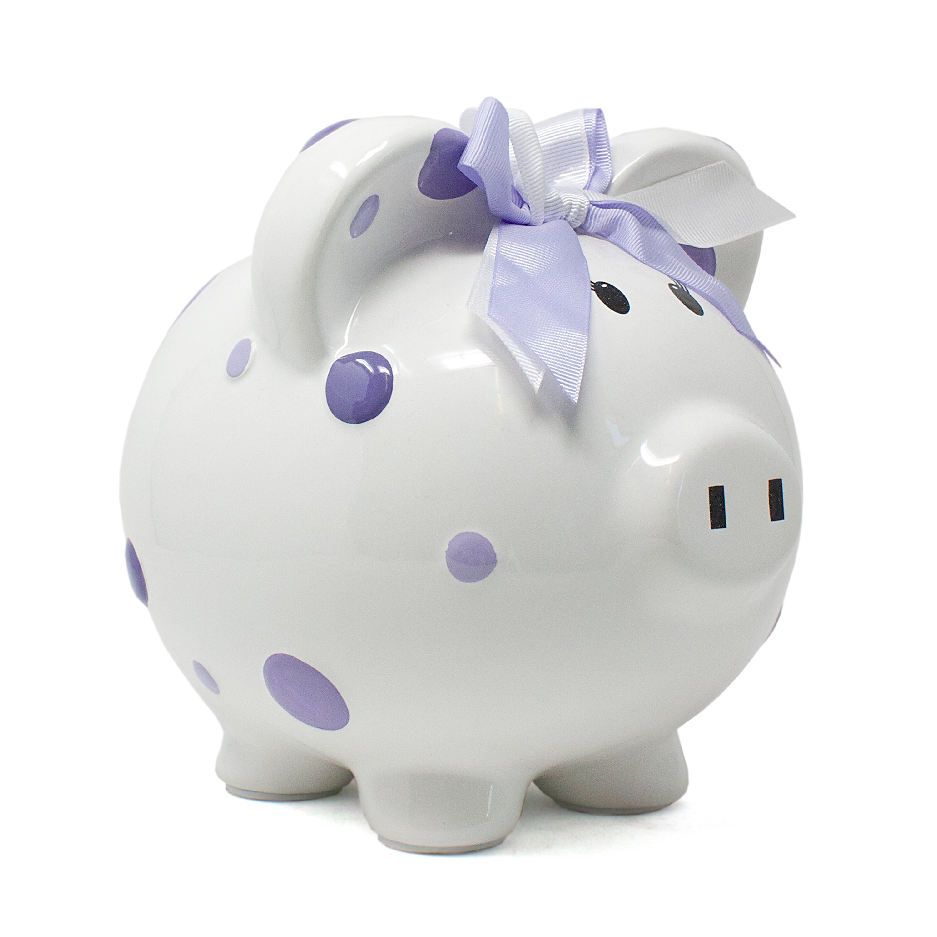 Side view of white ceramic piggy bank with purple polka dots and lavender white bow on ear