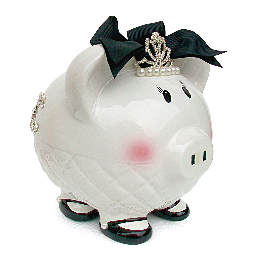 Front angle of white ceramic piggy bank with black bow, pearl tiara, and blush cheeks