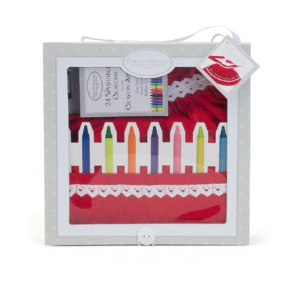Front view of the red cotton apron with white lace trim and colorful crayon pockets inside Kraft box