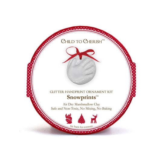 Snowprints Glitter Handprint Ornament Kit packaging with white circular ornament and red ribbon