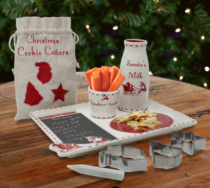 Child reaching for decorated cookies on Santa's Cookie Platter placed on a cozy furry surface