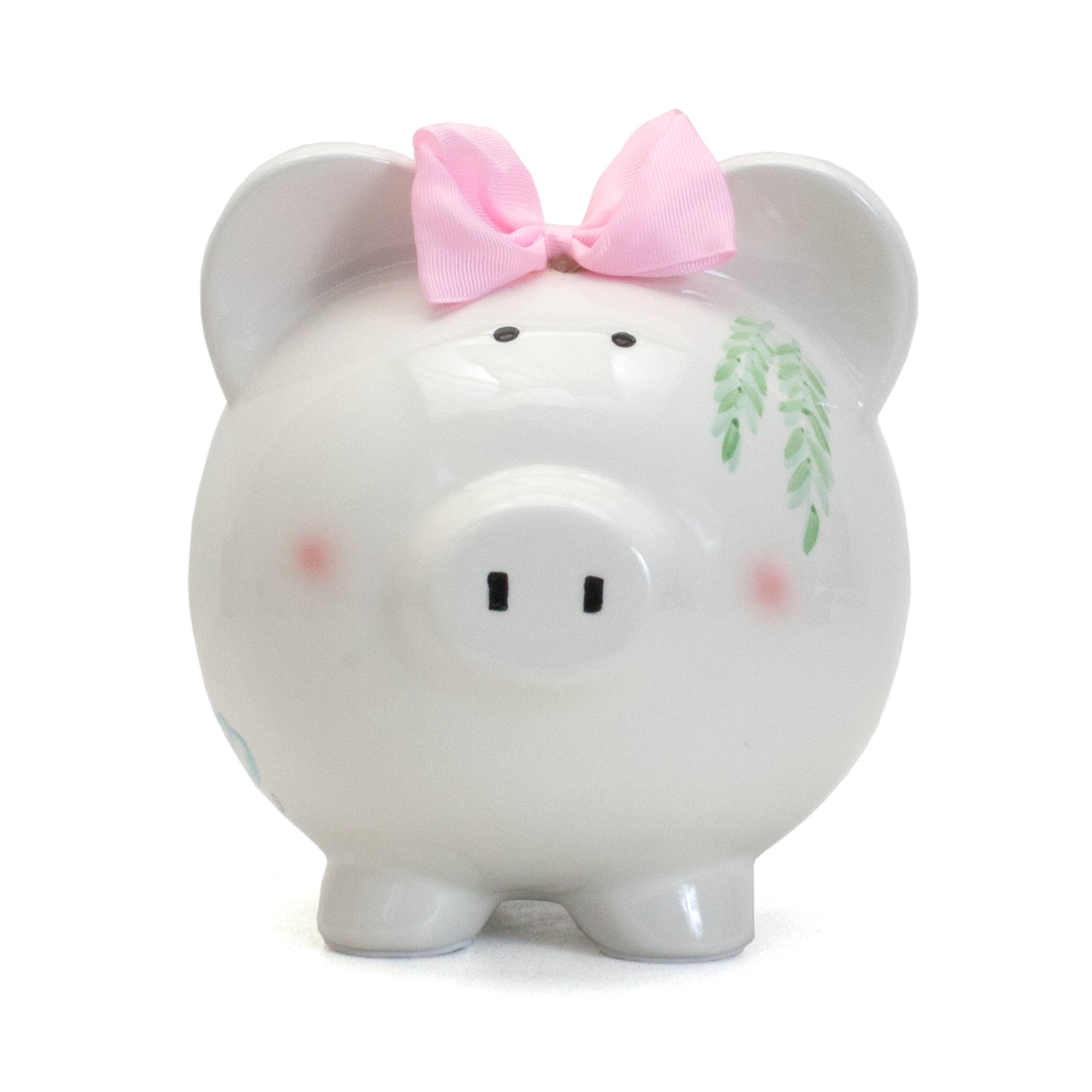 Front view of white ceramic piggy bank with pink bow and painted greenery