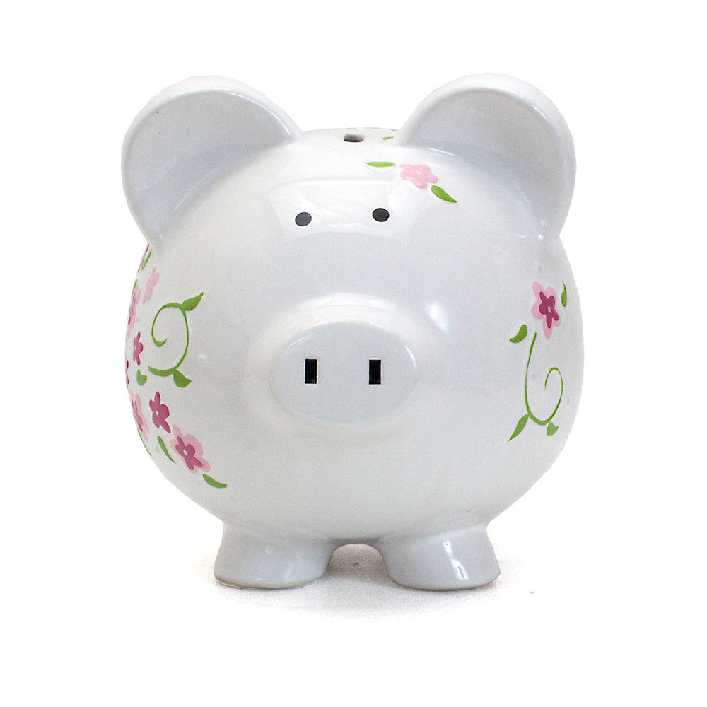 Front view of white piggy bank with handpainted small pink and purple flowers