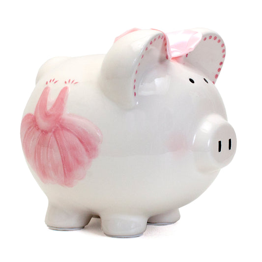 Side view of white ceramic piggy bank with pink tutu design and pink bow on ears