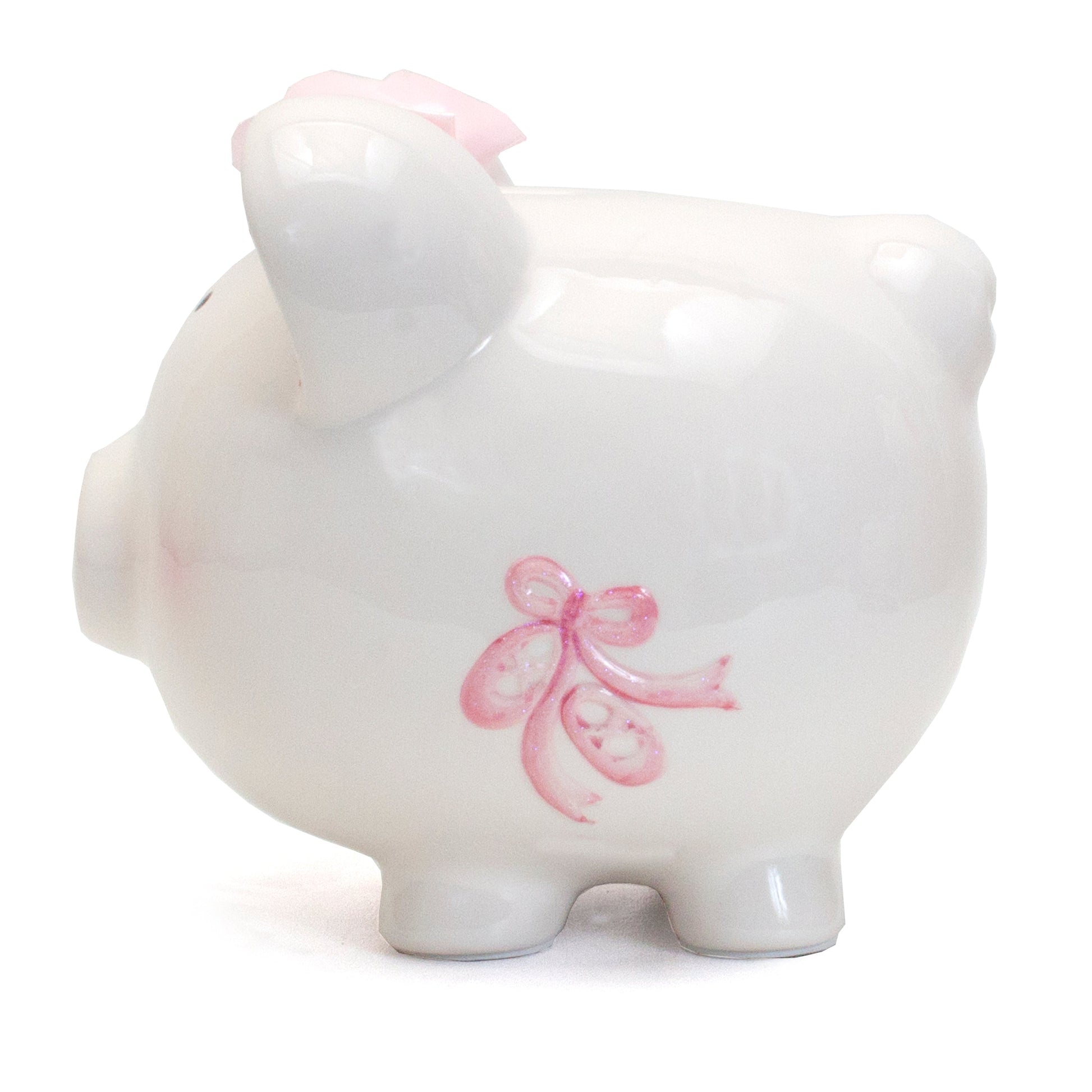 Rear view of glossy white piggy bank showing pink ribbon bow and smooth ceramic finish