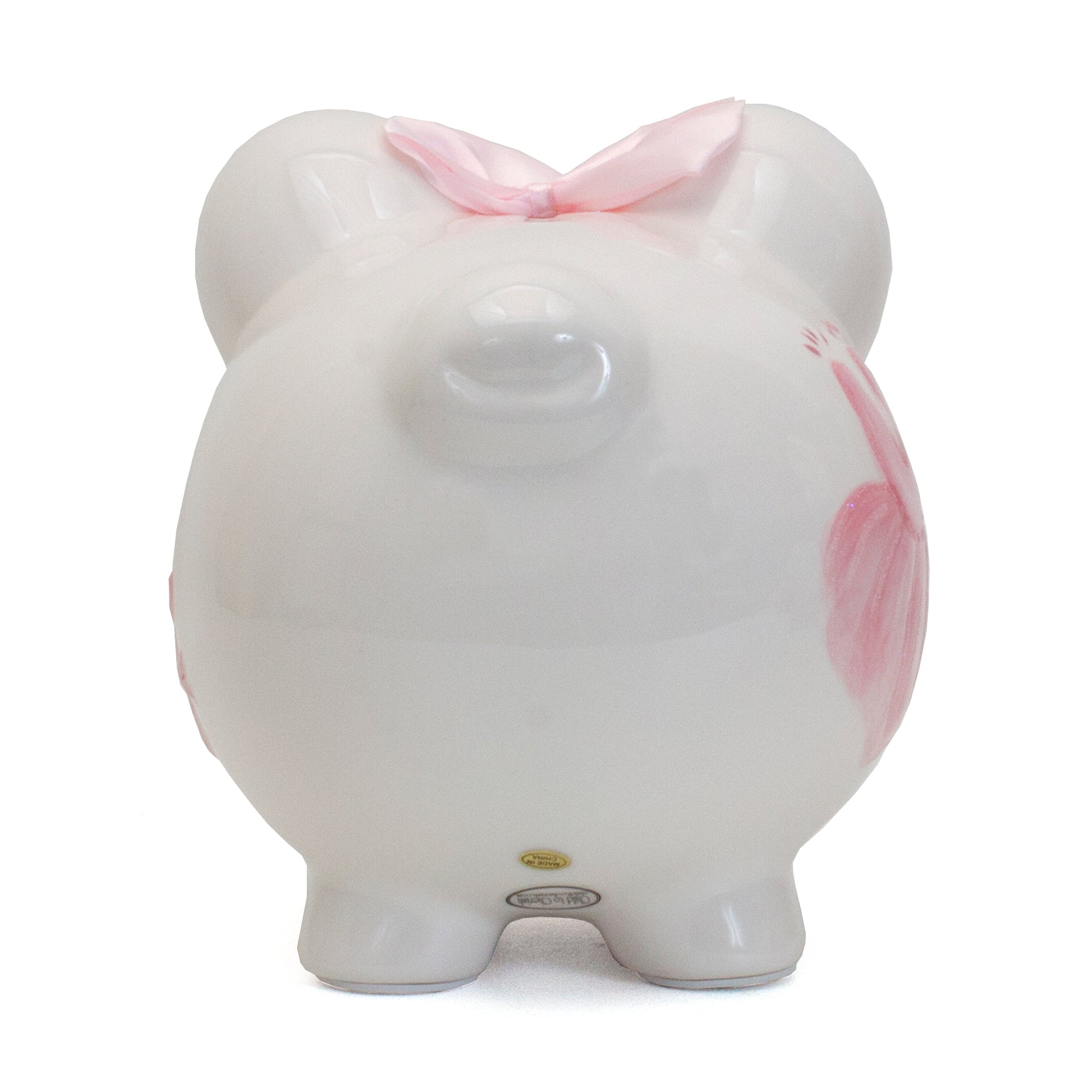 Bottom view highlighting labels and stable feet of handpainted piggy bank