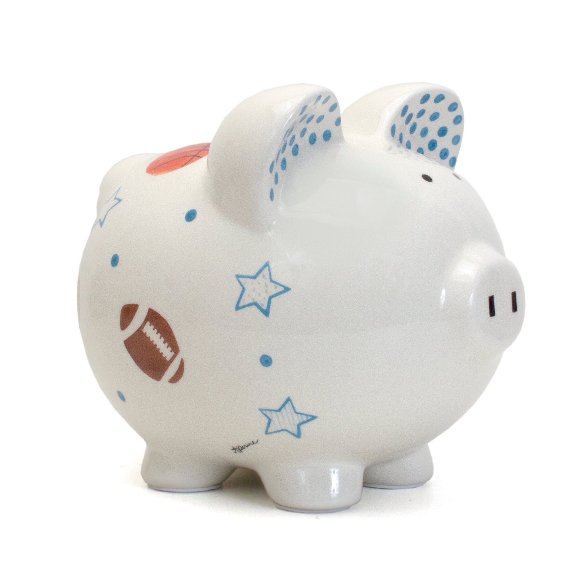 Side view of white piggy bank handpainted with football, basketball, stars, and blue dots