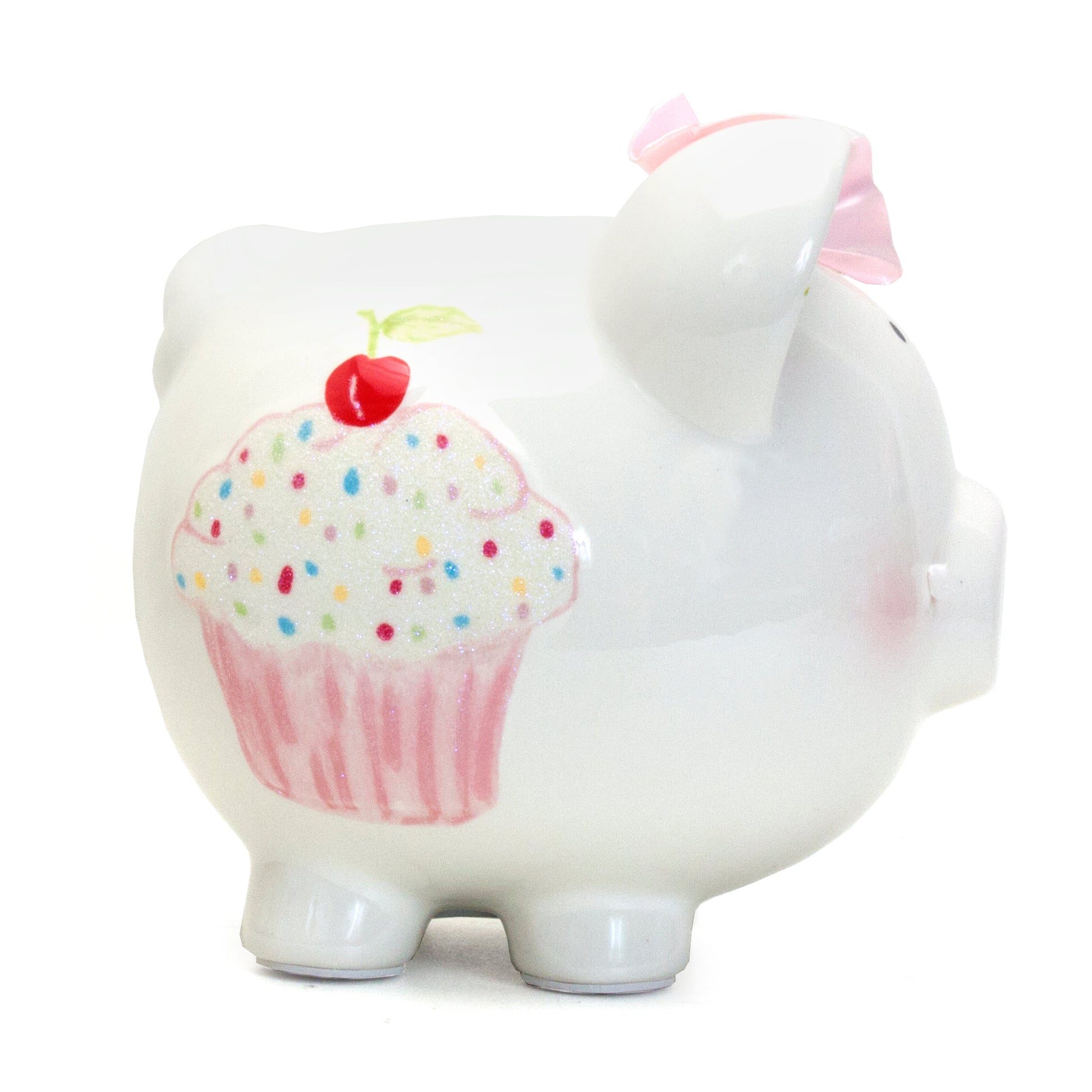 Side view of piggy bank featuring pink cupcake with sprinkles and cherry design