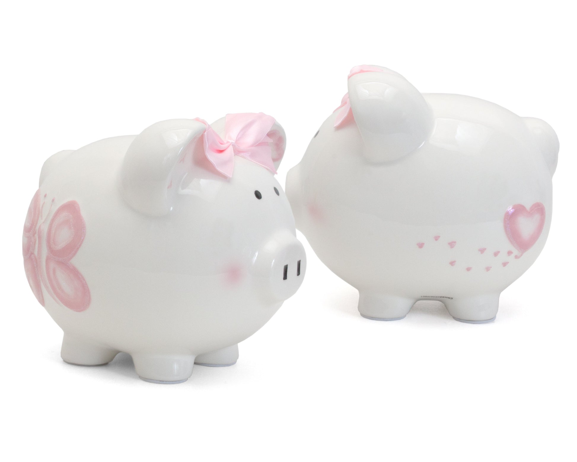 Close-up of handpainted pink butterfly design and pink satin bow on piggy bank