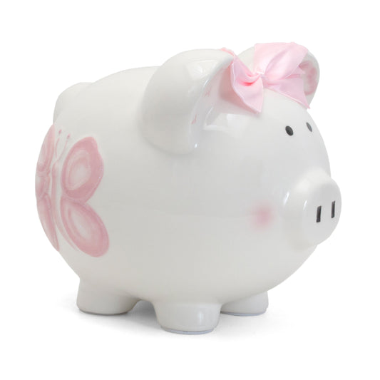 Side view of white ceramic piggy bank with pink butterfly and satin bow