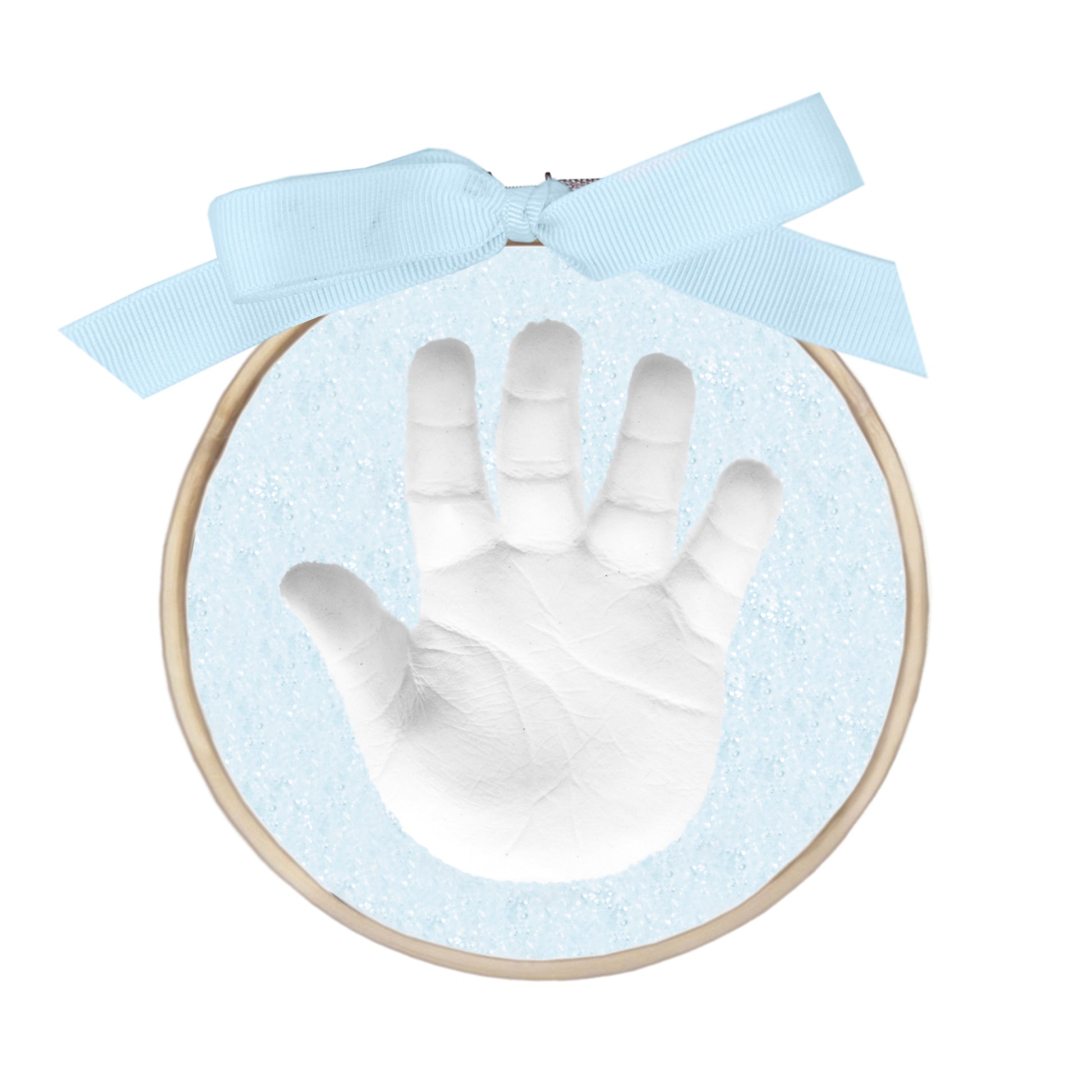 Finished handprint ornament with white handprint in blue glitter clay within a wooden ring and blue ribbon bow
