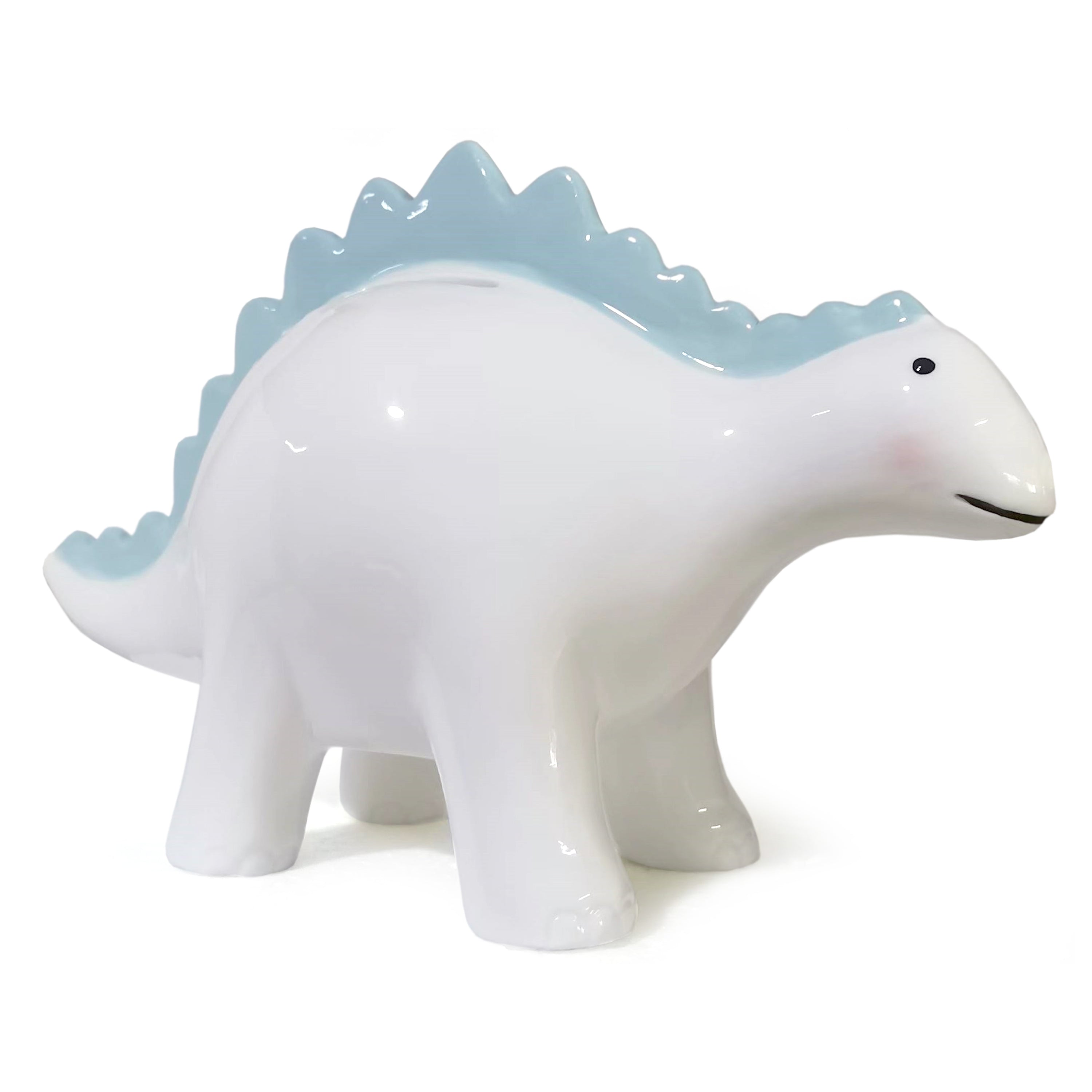 Side view of Theo the Dinosaur Blue ceramic piggy bank showing smooth white body and blue ridges along the back