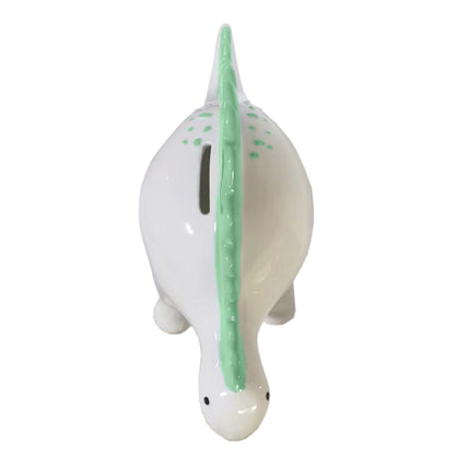 Top view of Theo the Dinosaur ceramic piggy bank displaying coin slot and green spikes