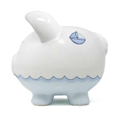 Side view of piggy bank displaying one sailboat and detailed handpainted waves around lower half