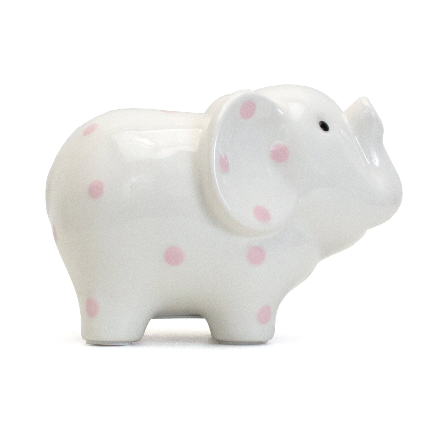 Left profile view of white ceramic elephant bank with pink polka dots