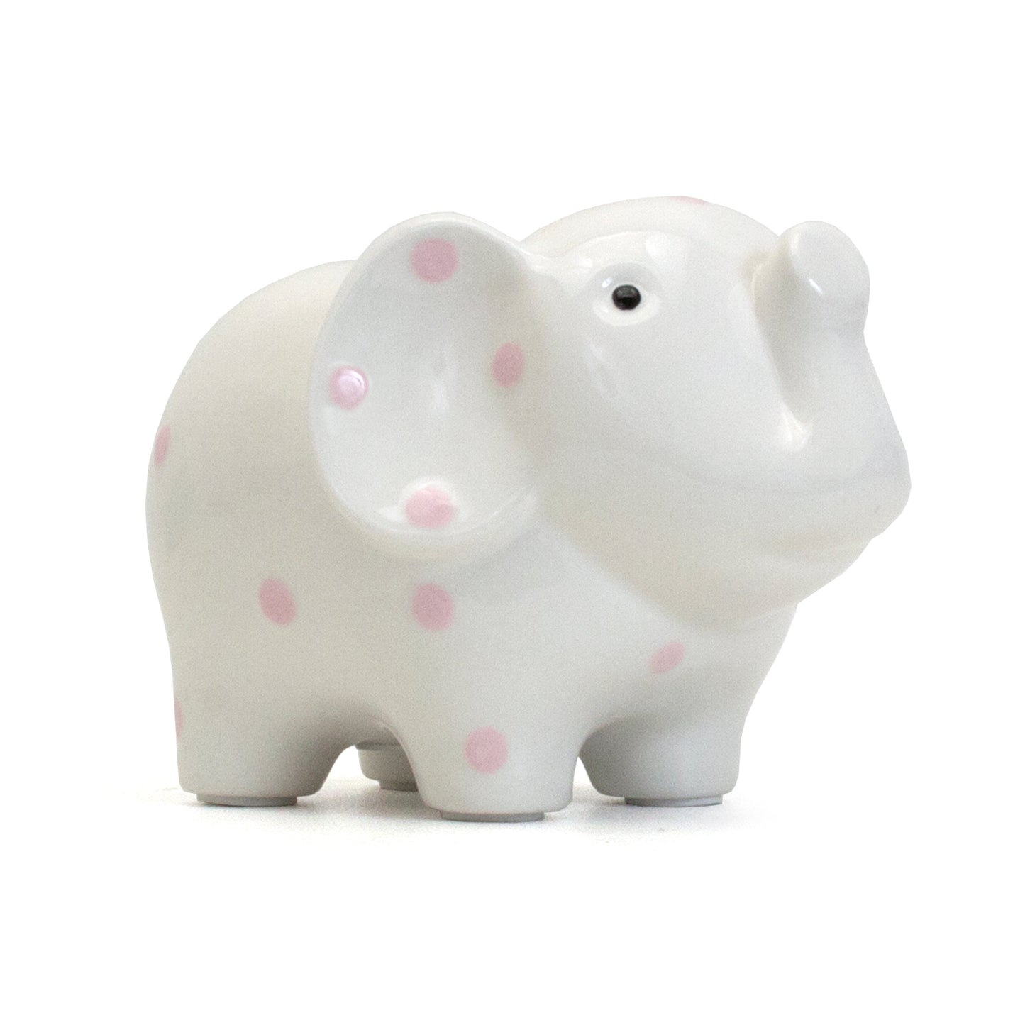 Front side view of white ceramic elephant bank with pink polka dots