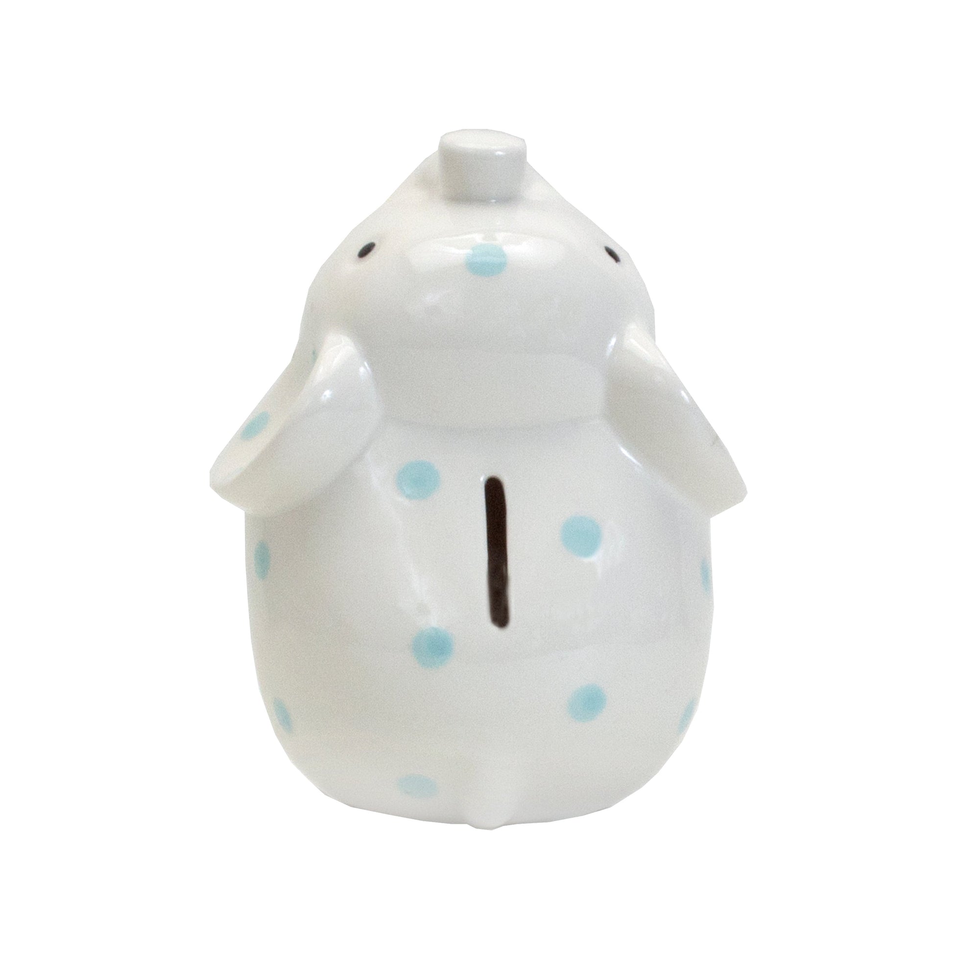 Rear view of white elephant piggy bank with blue polka dots