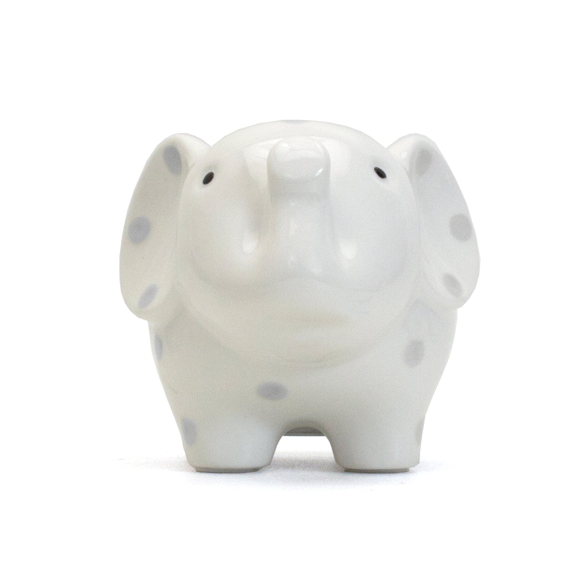 Front view of white elephant piggy bank with gray polka dots showing smiling trunk