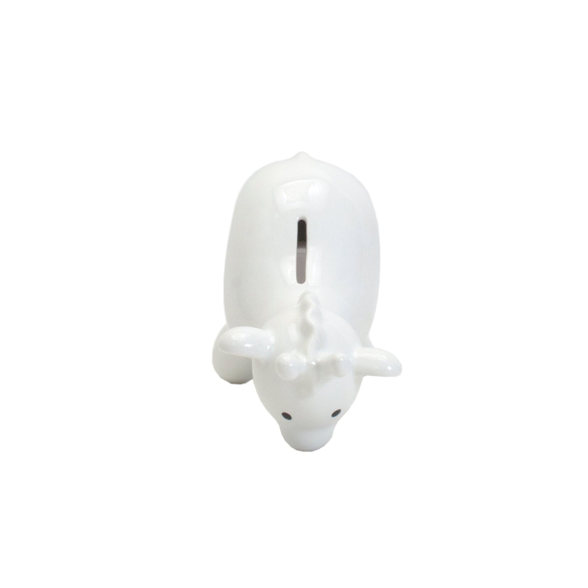 Top view looking down on white ceramic giraffe piggy bank