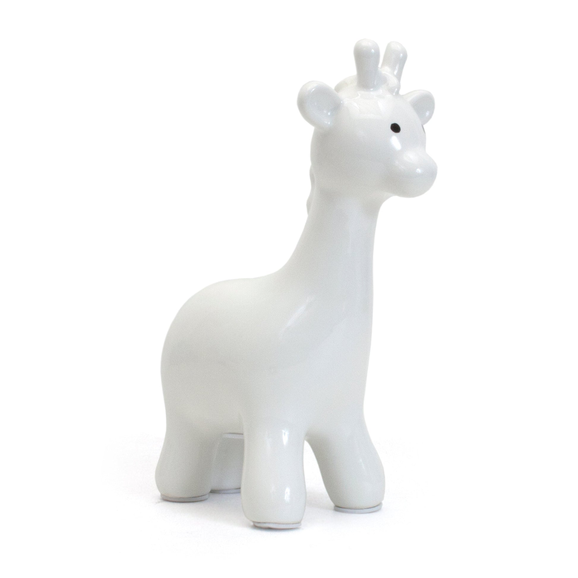 White ceramic giraffe-shaped piggy bank angled view