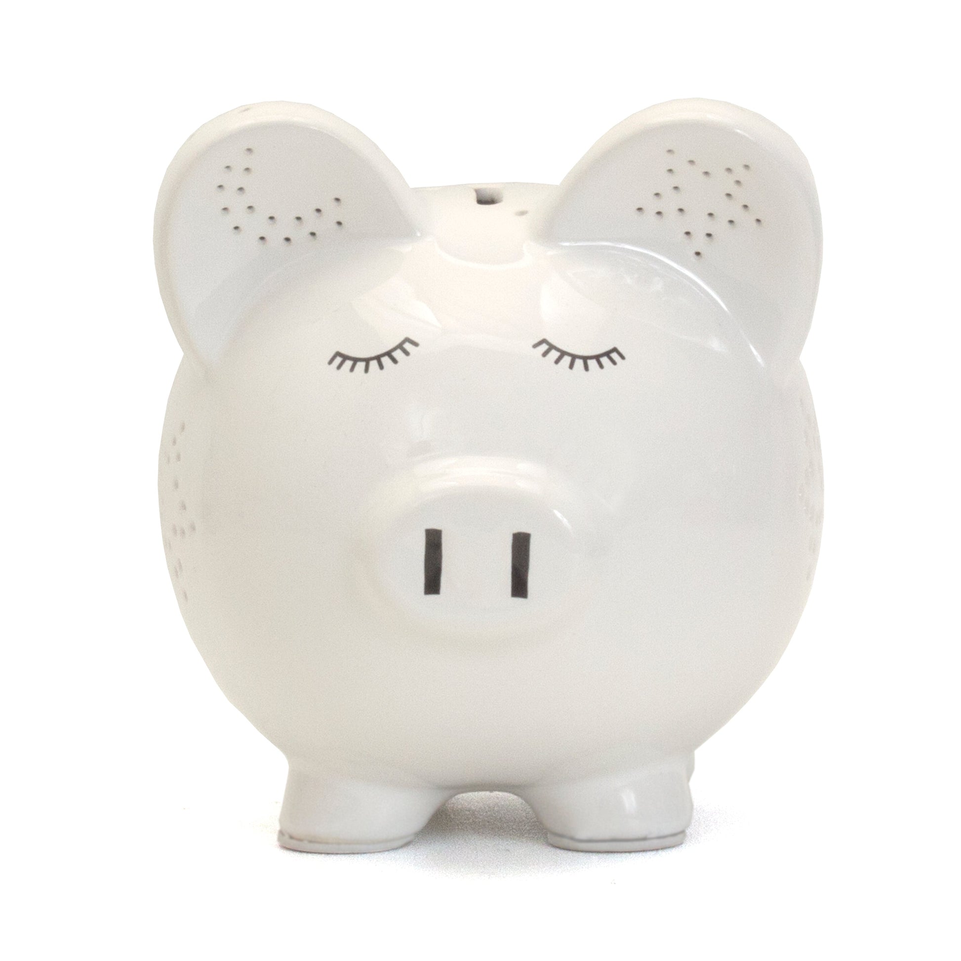 Front view of white piggy bank showing closed eyes and snout details