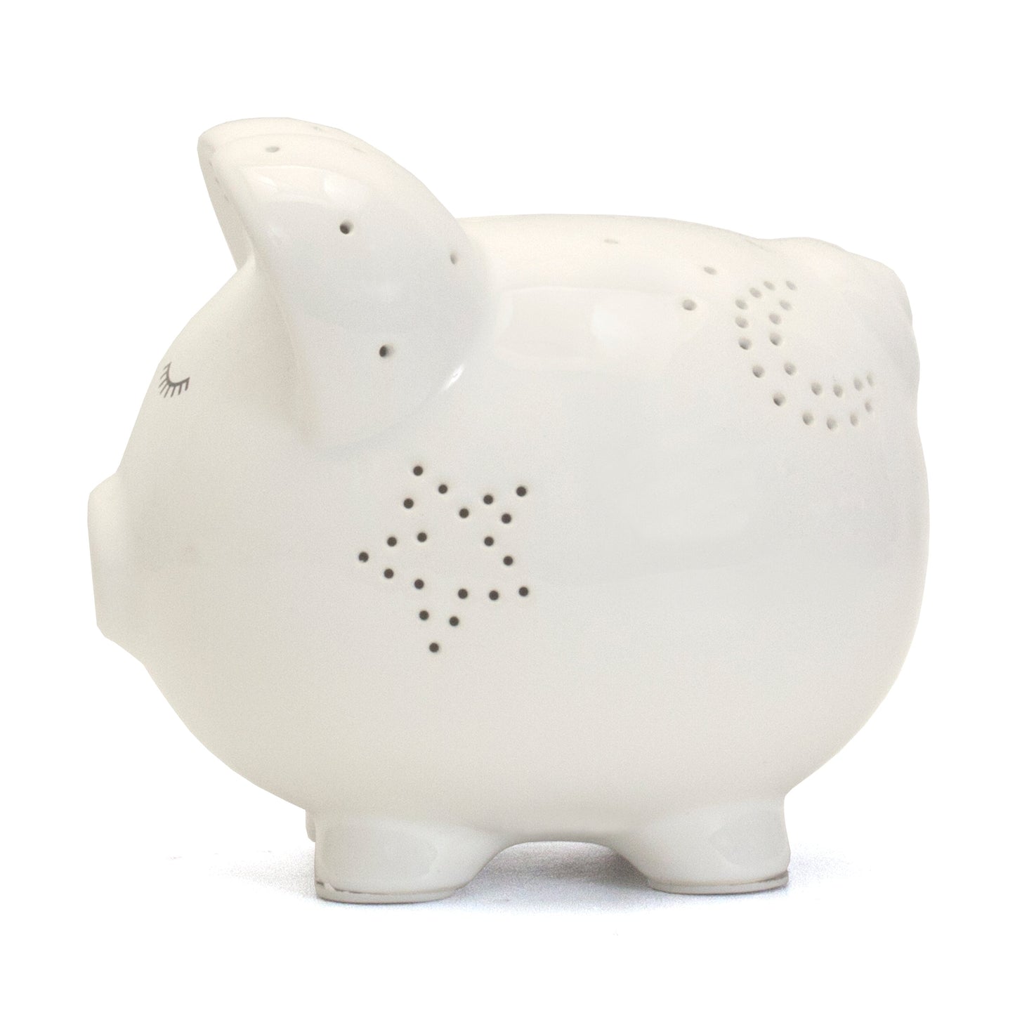 Opposite side view of white piggy bank with glowing star perforations