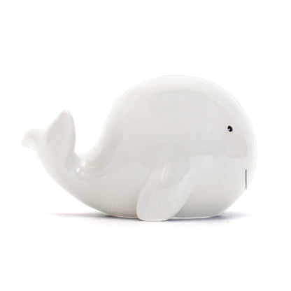 white ceramic whale piggy bank side profile showing tail and fins