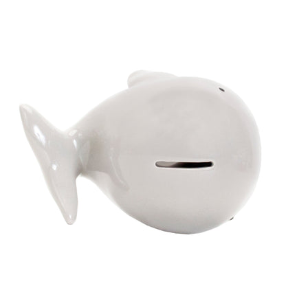 top view of white ceramic whale piggy bank highlighting whale tail