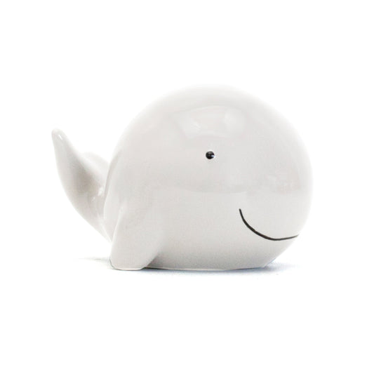 white ceramic whale piggy bank side view smiling face