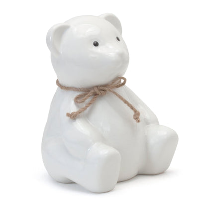 White ceramic teddy bear piggy bank with black eyes and twine bow